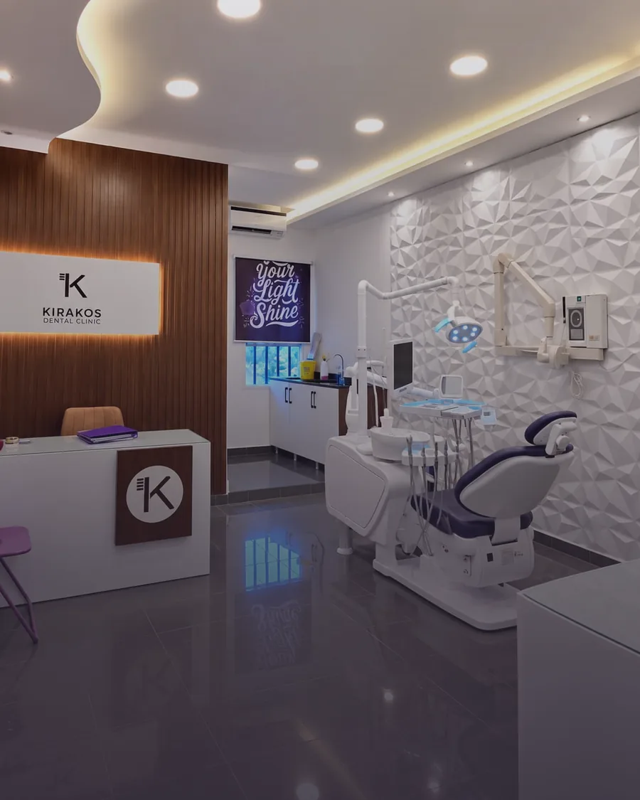 Wide view of the Zouk Mosbeh clinic reception, warm evening light, with a dark uncluttered lower area behind the headline text.